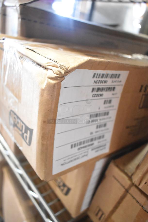 Two-tier lot of boxed items, including Clorox Disinfectant Spray and Expo White Board Care. Boxes show barcode labels.