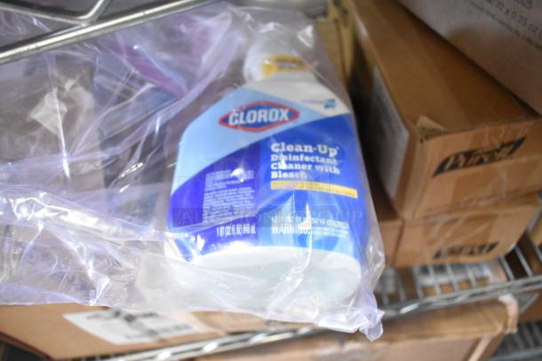 Two-tier lot with Clorox Disinfectant Cleaner with Bleach in plastic wrap on metal shelf.
