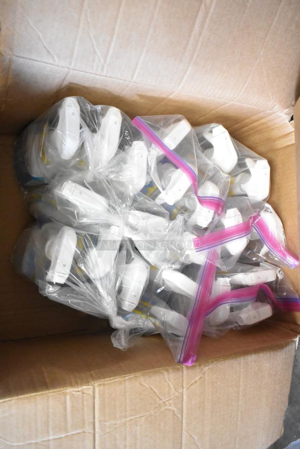 Cardboard box with multiple sealed plastic bags, each containing white spray tops, possibly for Clorox Disinfectant.