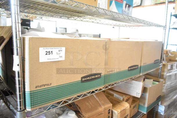 Cardboard boxes labeled "Bankers Box" on metal shelf; label reads "251 QTY Tier 104," indicating a lot of various items including paper.