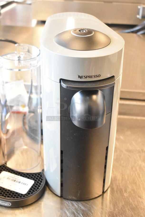 DeLonghi ENV150GY Nespresso VertuoPlus coffee machine in gray. Features single cup brewing, 120V, 1 phase, good condition.