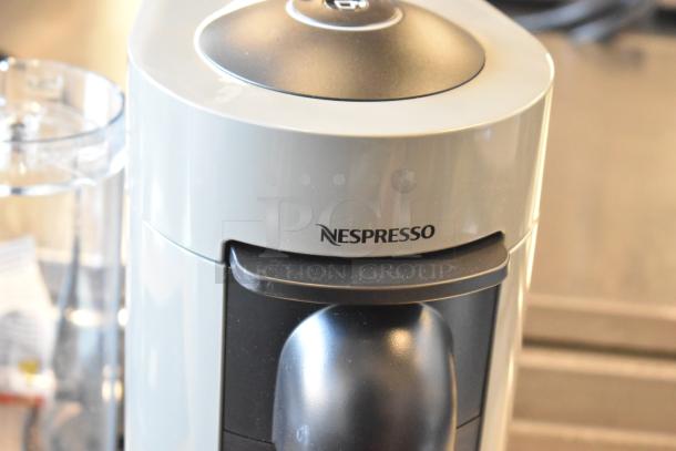DeLonghi ENV150GY Nespresso VertuoPlus coffee machine, gray, single cup, visible Nespresso logo, 120 Volts, 1 Phase.