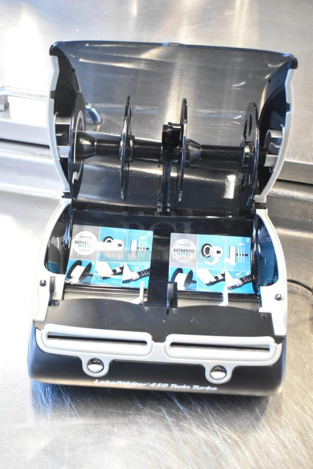 Dymo LabelWriter 450 Twin Turbo printer; dual-roll design, open with label rolls in place, "Authentic Dymo Labels" visible.