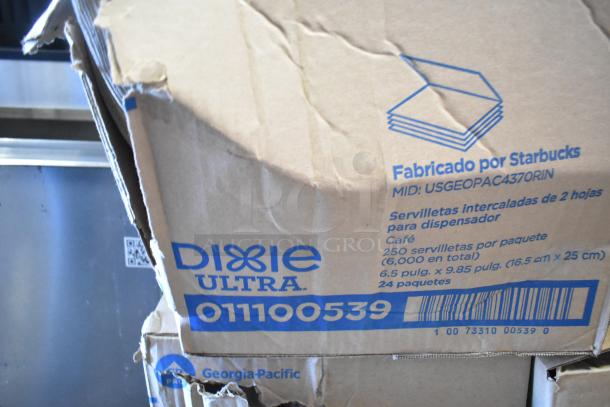 Nine boxes including WIN1420B centerpull towels and Dixie Ultra 011100539 towels, slightly worn, marked for Starbucks use.
