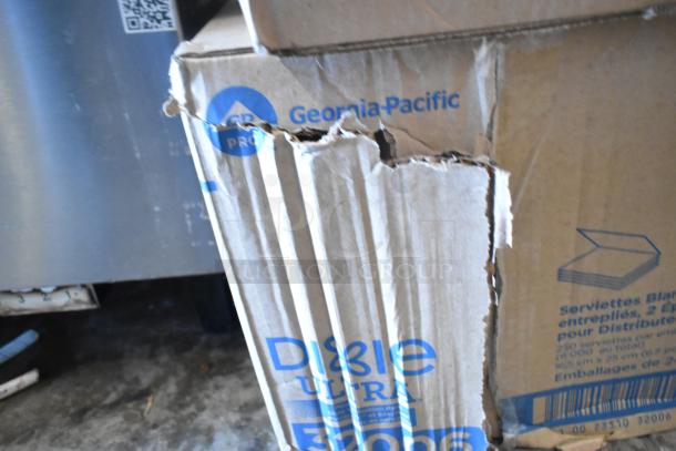 Nine boxes including WIN1420B centerpull towels and Dixie Ultra 011100539 towels. Boxes show visible wear.