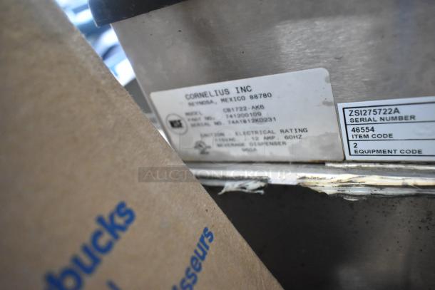 Stainless steel 6-flavor beverage machine with Cornelius drop-in ice bin. Model CB1722-AK6, 115V, 1 phase. Labels visible.