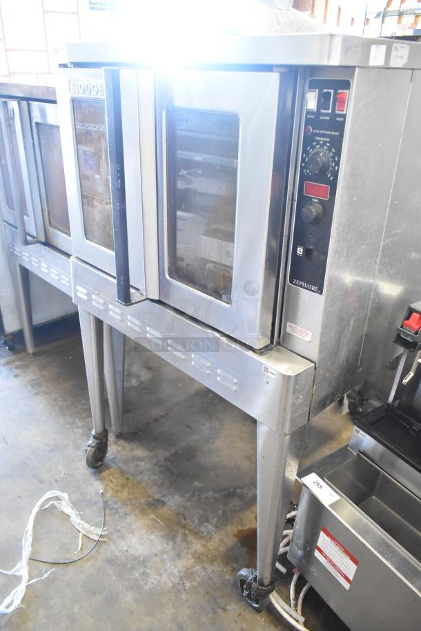 Blodgett Zephaire 200 stainless steel convection oven, view-through doors, metal racks, thermostatic controls, on casters.