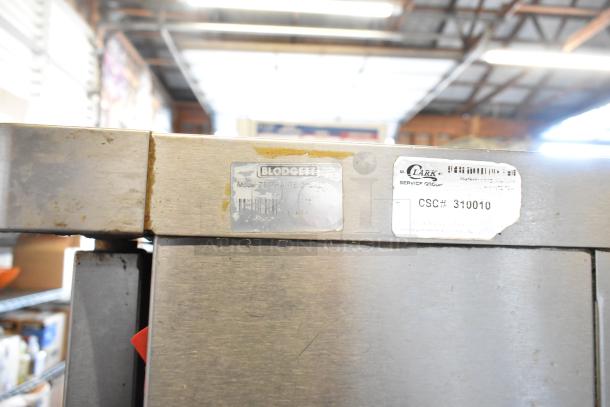 Blodgett Zephaire 200 convection oven, stainless steel, thermostatic controls, view-through doors, metal racks, legs on casters.