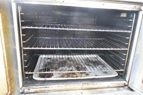 Blodgett Zephaire 200 stainless steel commercial convection oven with metal racks and view-through doors. Used condition.