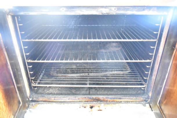 Blodgett Zephaire convection oven, stainless steel, full size with view-through doors, metal racks, thermostatic controls.