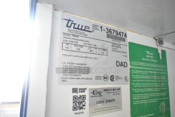 True TM-24 stainless steel commercial reach-in cooler label, showing model, voltage, phase, and certification details.