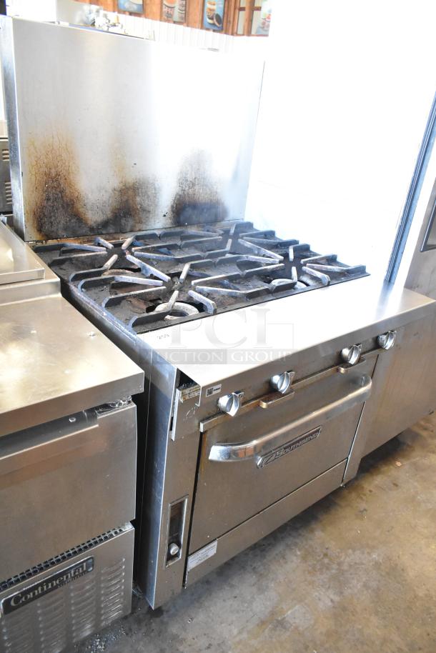 2016 Southbend P36D-XX stainless steel 4-burner natural gas range with oven, used condition, visible staining on back splash.