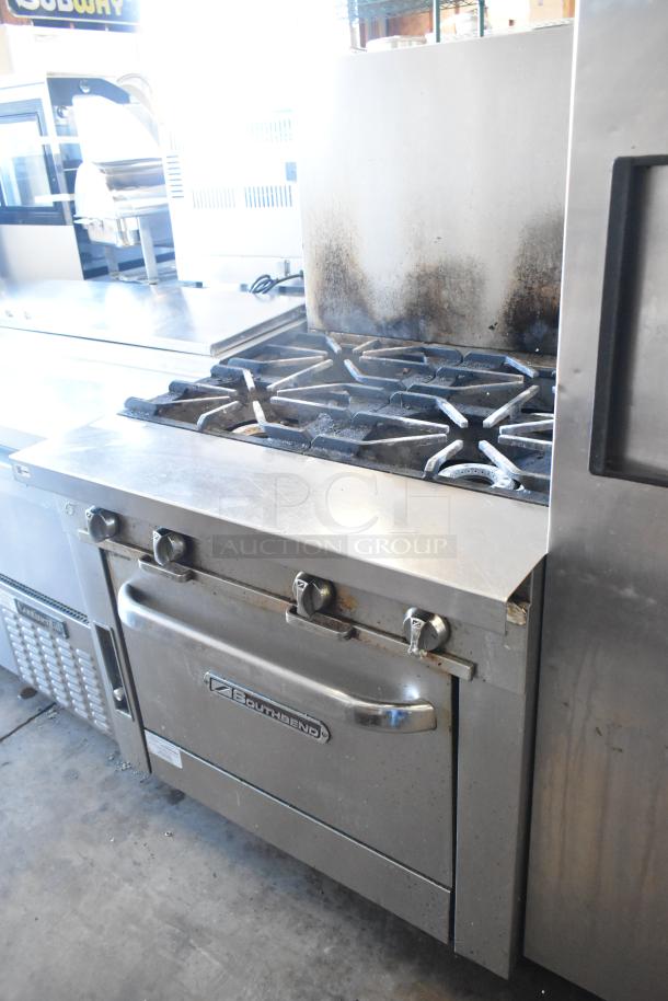 2016 Southbend P36D-XX stainless steel 4 burner range with oven and backsplash. Visible wear on backsplash.