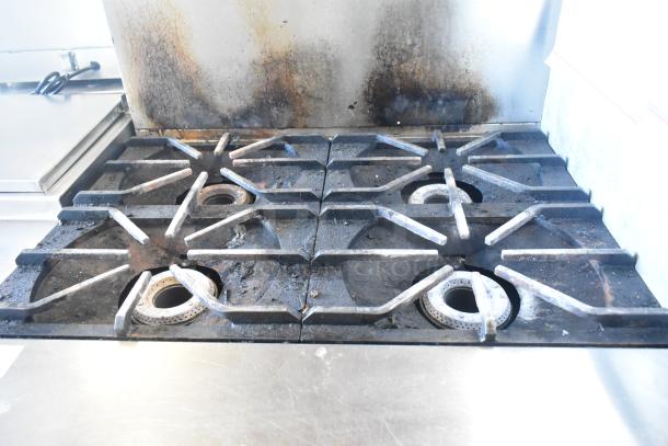 2016 Southbend P36D-XX 4 burner range with oven, stainless steel, visible wear, natural gas, back splash included.