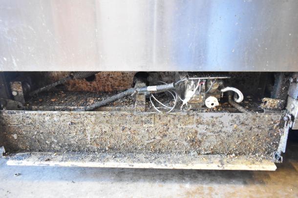 2016 Southbend P36D-XX commercial range. Stainless steel, 4 burners, oven, backsplash. Visible wear and grease buildup.