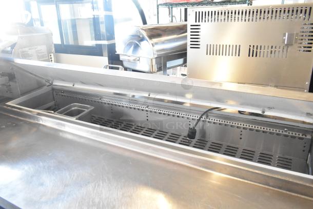 2017 Continental CPA68 stainless steel commercial prep table with two drawers, two doors, and commercial casters. 115V, 1 phase.