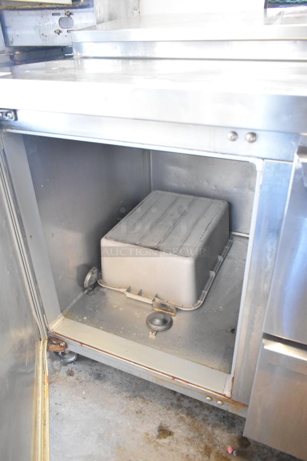 2017 Continental CPA68 stainless steel prep table with 2 drawers, 2 doors, commercial casters; visible rust, used condition.