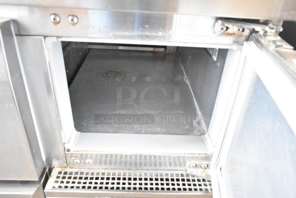 2017 Continental CPA68 stainless steel prep table, 2 drawers, 2 doors, on commercial casters. 115V, 1 phase, with visible wear.