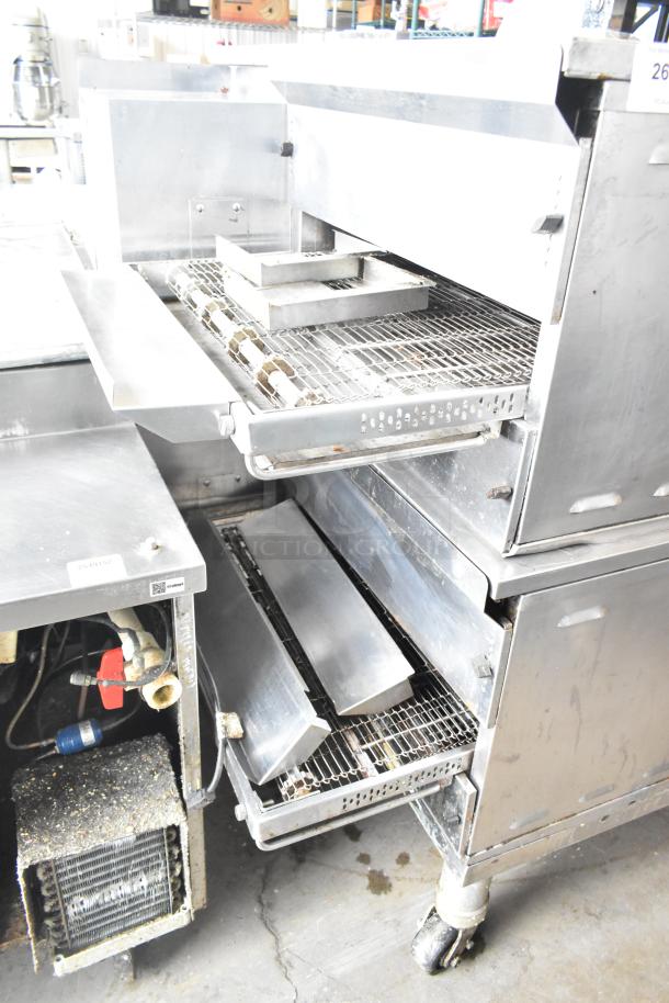 Two 2021 Middleby Marshall PS638G stainless steel conveyor pizza ovens on casters, 89,000 BTU, natural gas powered.