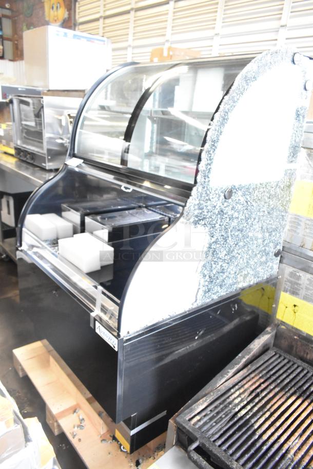 Avantco metal commercial open merchandiser with top case; note visible glass damage.