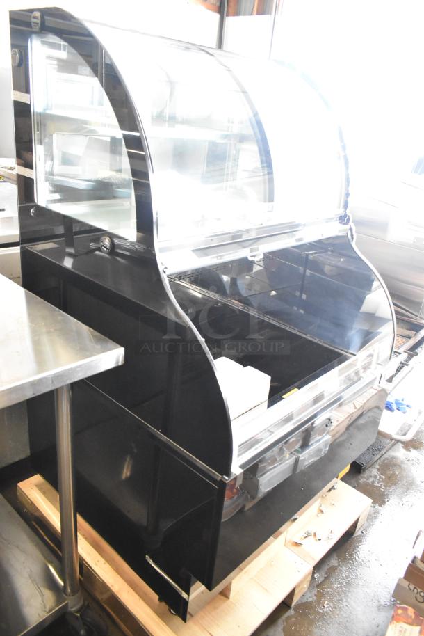 Avantco metal commercial floor-style open merchandiser with top case, visible glass damage, sturdy black exterior.