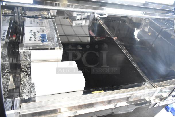 Avantco metal commercial horizontal open merchandiser, features top case, visible glass damage, suitable for retail display.