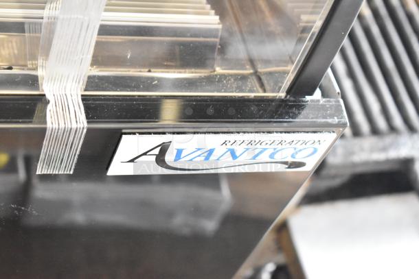 Avantco commercial fridge with visible glass damage, metal construction, floor style, open merchandiser, top case.