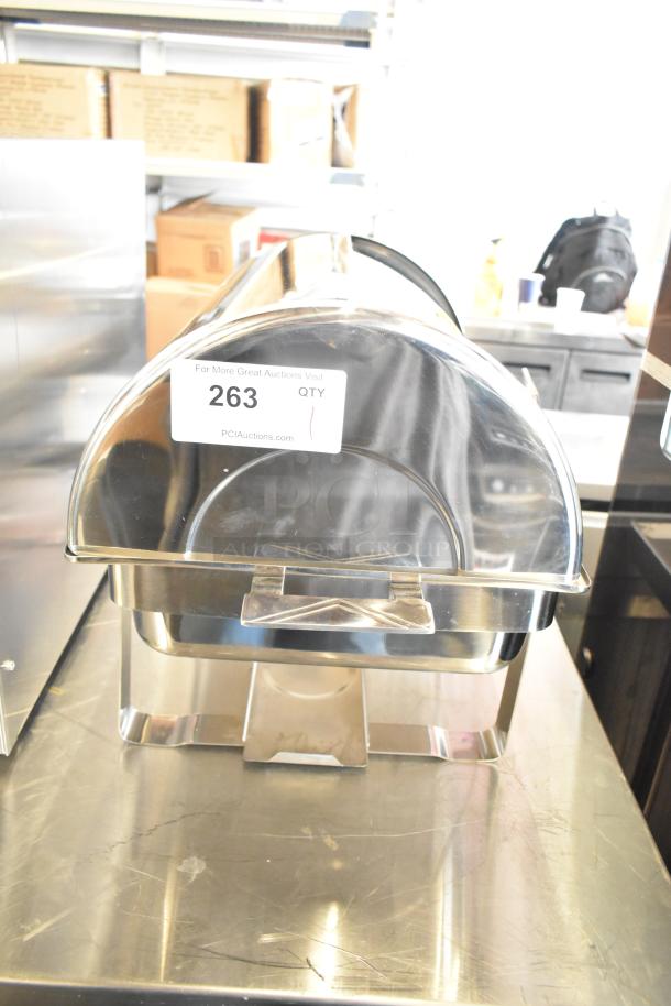 Brand new stainless steel chafing dish with scratches and dents, auction tag number 263 visible.