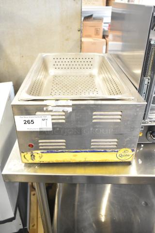 Qualite stainless steel commercial countertop food warmer, 115 volts, 1 phase. Visible wear, intact labels, perforated insert.