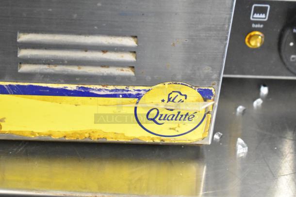Qualite stainless steel commercial countertop food warmer. Features include 115 volts, 1 phase, and a visible brand label.