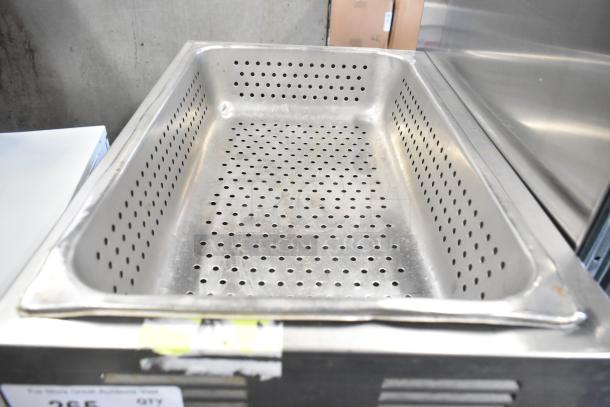Qualite stainless steel commercial countertop food warmer, 115 volts, 1 phase, perforated interior, good condition.