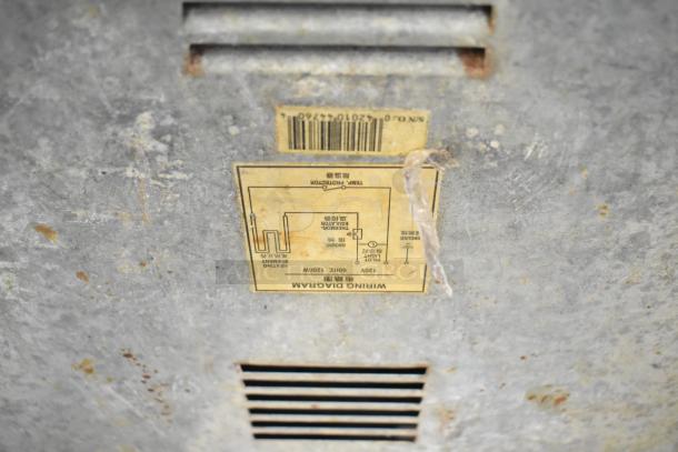 Qualite stainless steel commercial food warmer. Features 115 volts, 1 phase power. Visible wiring diagram and serial number. Used condition.