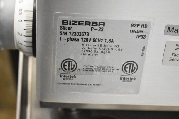 2023 Bizerba GSP HD Meat Slicer label details serial number, voltage, and certifications on stainless steel surface.