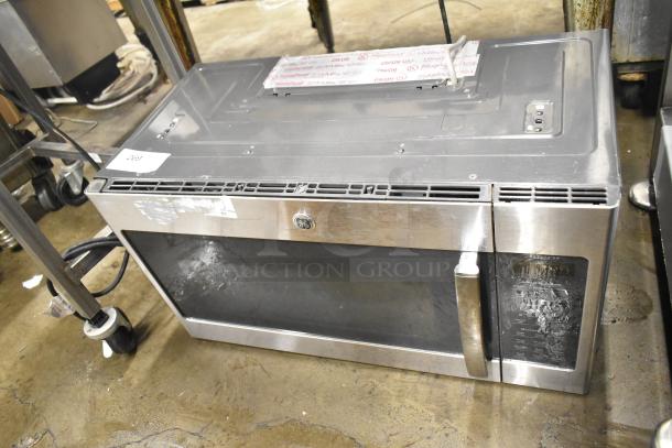 2016 GE DVM7195SK1SS stainless steel microwave oven, 120 volts, 1 phase, visible wear, GE logo on front.