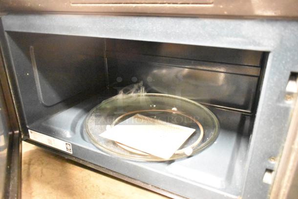 2016 GE DVM7195SK1SS stainless steel microwave oven, interior view, 120 volts, glass turntable, vent filter included.