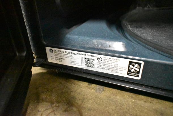 2016 GE DVM7195SK1SS stainless steel microwave, 120V, 1 phase. Interior label shows model and specs.