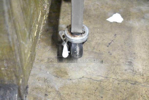 Belshaw H&I icing station caster wheel, stainless steel, commercial-grade, 115V, 1 phase, visible wear.