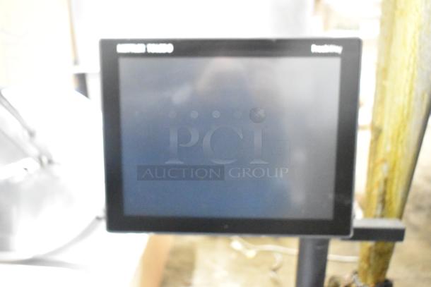 Mettler Toledo FreshWay stainless steel countertop scale, black display, 100-240V, 1 phase, model name visible on screen.