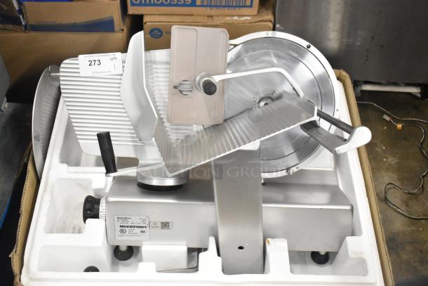 Bizerba SE 12 US stainless steel commercial meat slicer, 120 volts, 1 phase, in original packaging.
