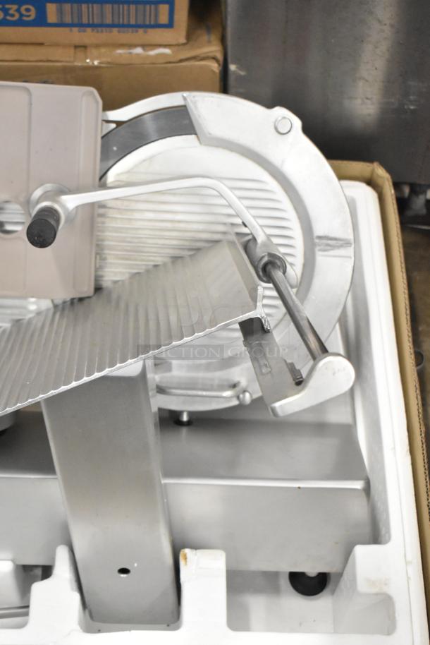 Bizerba SE 12 US stainless steel commercial meat slicer, 120 volts, 1 phase, in good condition, visible blade and handle.