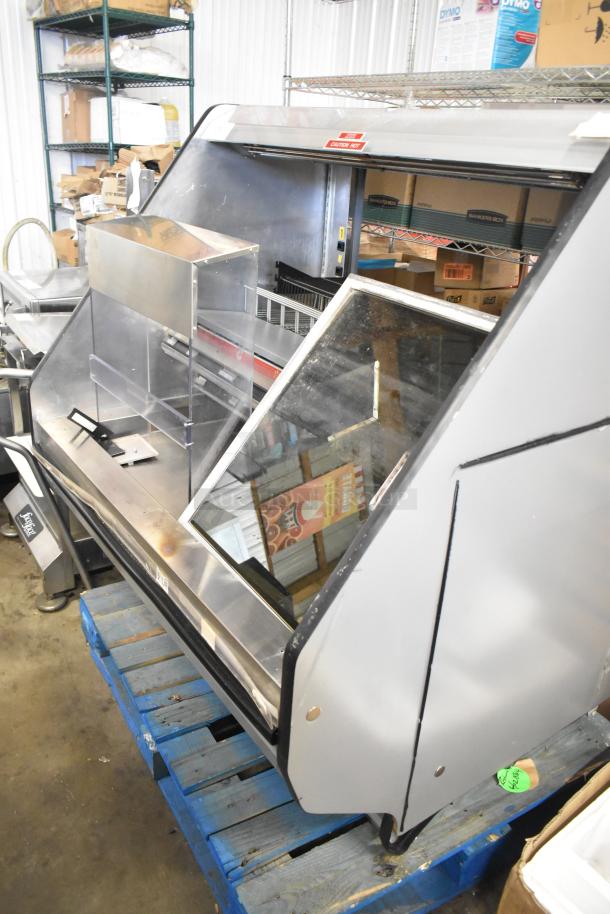 Metal Commercial Horizontal Grab N Go Merchandiser, silver, glass front, used condition, visible "Caution Hot" label.