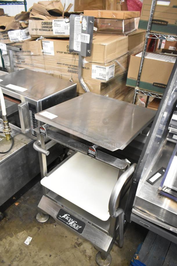 Face to Face stainless steel commercial meat slicer stand, includes lower shelf, curved handles, sturdy, excellent condition.