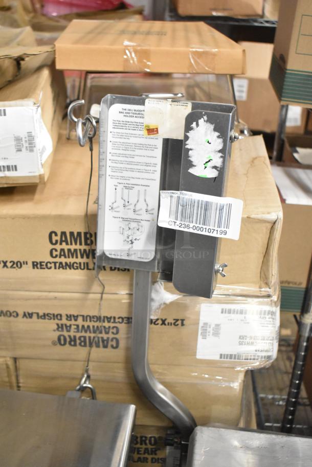 Face to Face stainless steel commercial meat slicer equipment stand with attached instructions and barcode label.