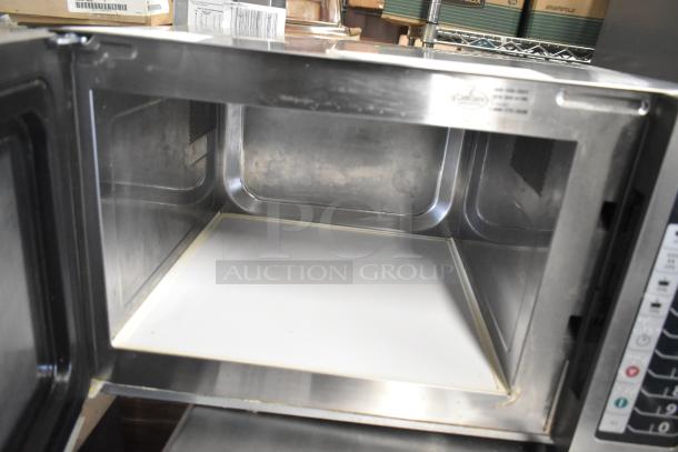 Amana RCS10TS stainless steel commercial microwave oven, open door view, model tag visible, excellent condition.