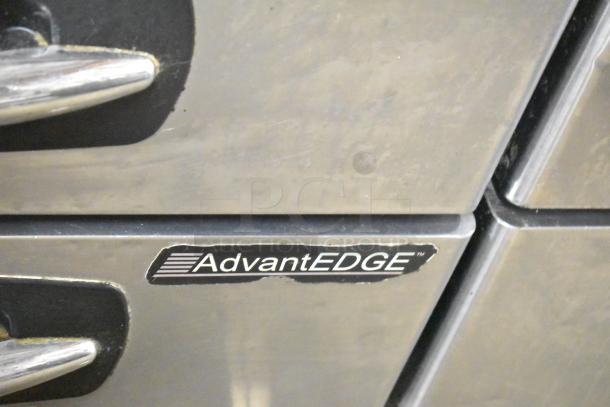 Stainless steel AdvantEDGE 4 drawer chef base, commercial casters, 115V, 1 phase, branded label visible.