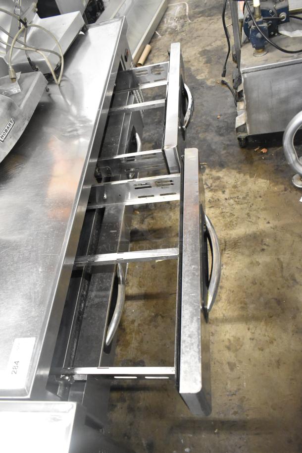 Stainless steel commercial 4 drawer chef base on casters, 115 volts, 1 phase, sturdy handles, excellent condition.