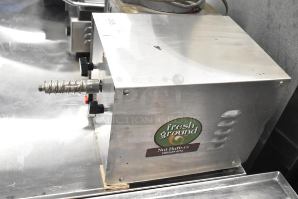 Olde Tyme stainless steel nut grinder base, commercial countertop model, 115 volts, visible "fresh ground nut butters" label.