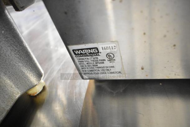 Waring WPG250B stainless steel commercial panini press, 208 volts, 1 phase. Label shows model and commercial use approval.