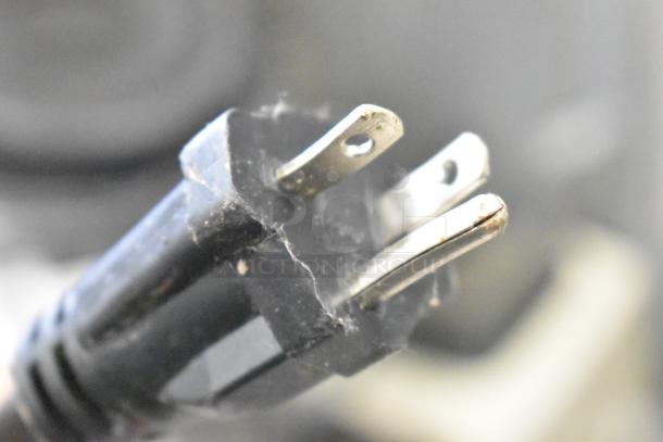 Power plug for Waring WPG250B stainless steel commercial panini press, showing three-prong connection.