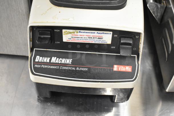 VitaMix commercial countertop blender, Drink Machine model, high performance, 120V, used condition with appliance repair sticker.